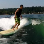 Longboard wakesurfing on Lake Sammamish 2011   9′ 6″ Becker pu single fin with side bites.