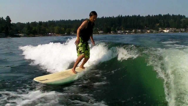 Longboard wakesurfing on Lake Sammamish 2011   9′ 6″ Becker pu single fin with side bites.